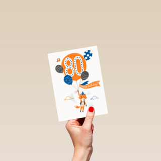 een vos met ballon om 80 jaar te vieren