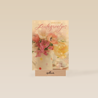 vrolijke lentegroetjes kaart met mooie bloemen in een vaas
