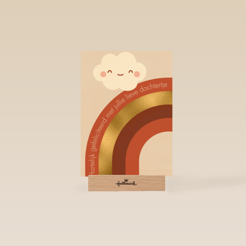 Regenboog met een lachend wolkje