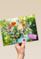 Bloemen in een gieter fijne paasdagen