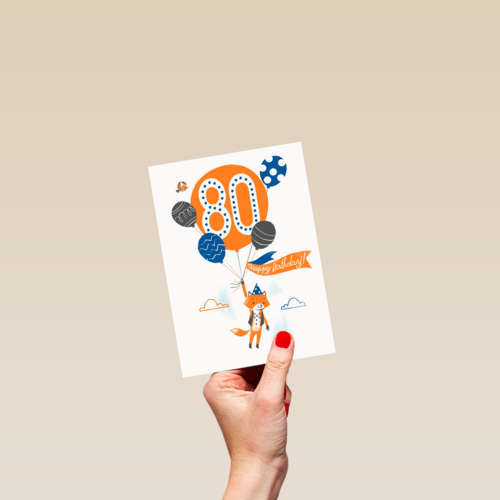 een vos met ballon om 80 jaar te vieren