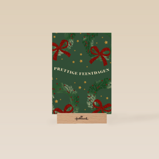 kerstkaart met kerststrikken op groene achtergrond