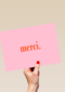 merci op roze achtergrond