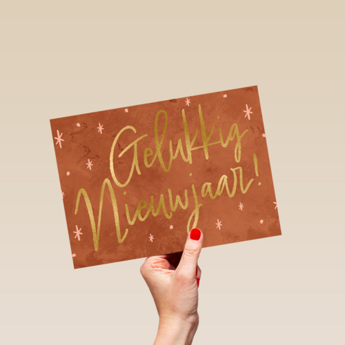 nieuwjaarskaart met gouden tekst en sterren