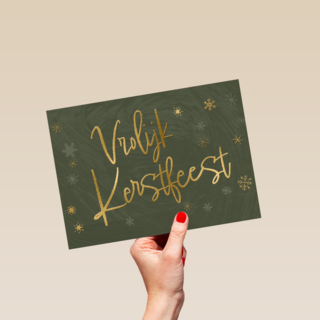 vrolijk kerstfeest in gouden letters op groen