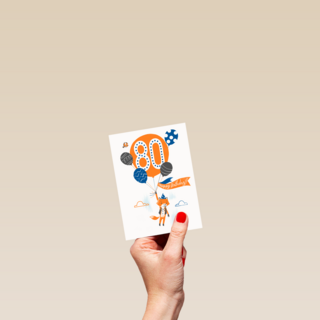 een vos met ballon om 80 jaar te vieren