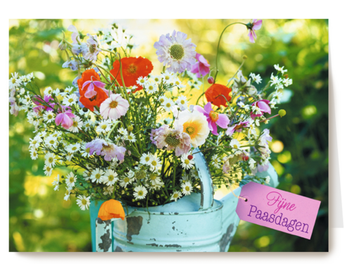 Bloemen in een gieter fijne paasdagen