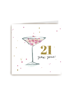 21 years young with a pink cocktail