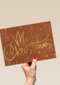 kerstkaart met gouden tekst en sterren