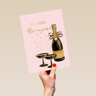 gelukkig nieuwjaar met flesje champagne en glazen