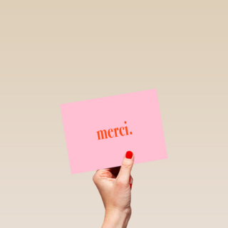 merci op roze achtergrond