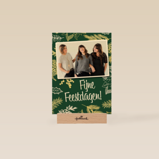 kerst zakelijk fotokaart met bladeren op groen